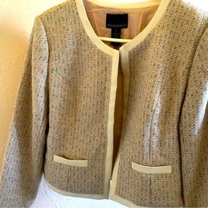 Beautiful jacket to elevate any look. Small bits of color but a neutral look.